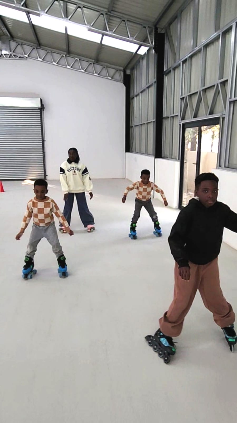 Children skating across the Da Rolly rink floor