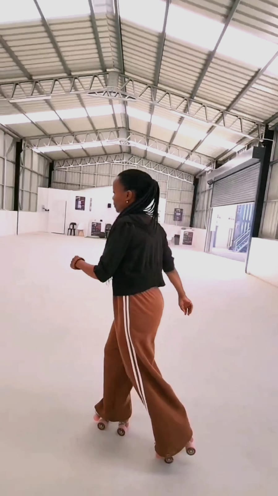 Skater gliding across the indoor rink